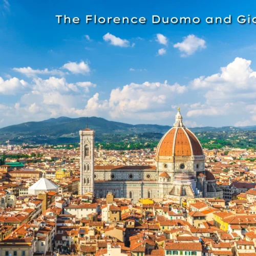 The grand terracotta dome of the Florence Cathedral standing next to the tall, ornate Giotto's Bell Tower.