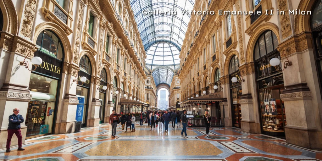 Interior view of the historic Galleria Vittorio Emanuele II shopping arcade featuring a massive glass-vaulted ceiling.