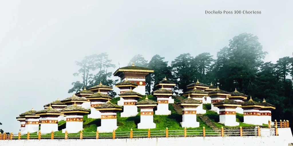 108 memorial chortens at Dochula Pass with snow-capped Himalayan peaks in the background.