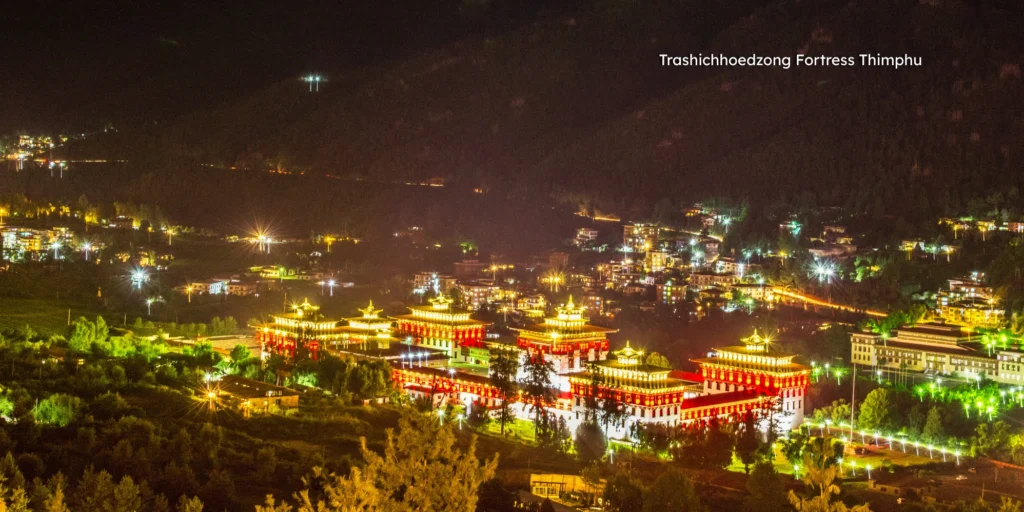 Traditional Bhutanese architecture of Trashichhoedzong fortress illuminated at night in Thimphu.