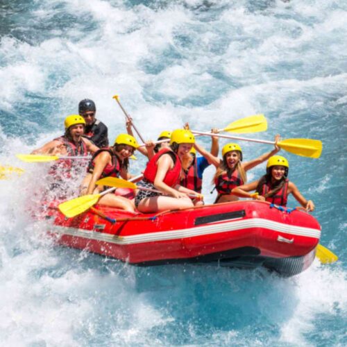 Tourists enjoying river rafting and boating in Dawki Umngot River Meghalaya