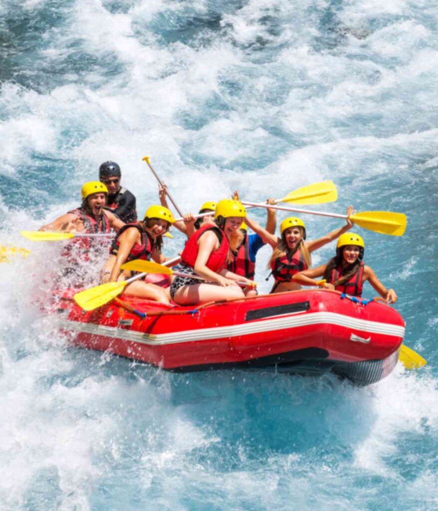 Tourists enjoying river rafting and boating in Dawki Umngot River Meghalaya