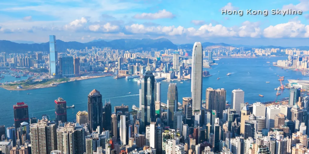 Panoramic twilight view of the Hong Kong city skyline and Victoria Harbour, a primary destination in our East Asian travel itinerary.