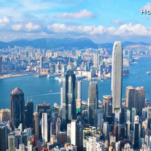 Panoramic twilight view of the Hong Kong city skyline and Victoria Harbour, a primary destination in our East Asian travel itinerary.