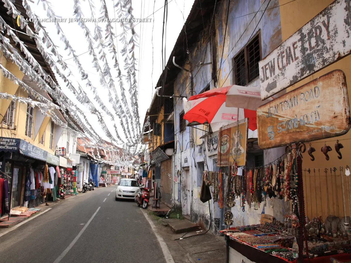 Historic cobblestone streets of Jew Town, antique shops, and Paradesi Synagogue clock tower in Mattancherry Kochi