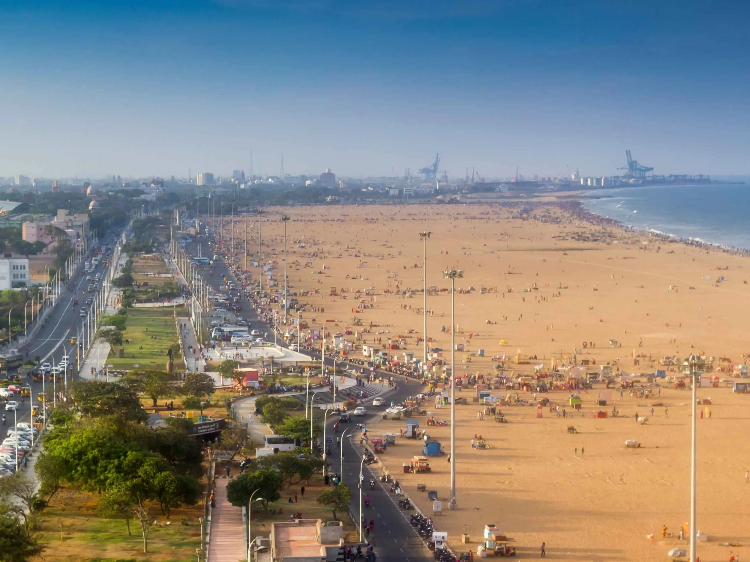 Golden sunrise over the Bay of Bengal at Marina Beach Chennai with fishing boats