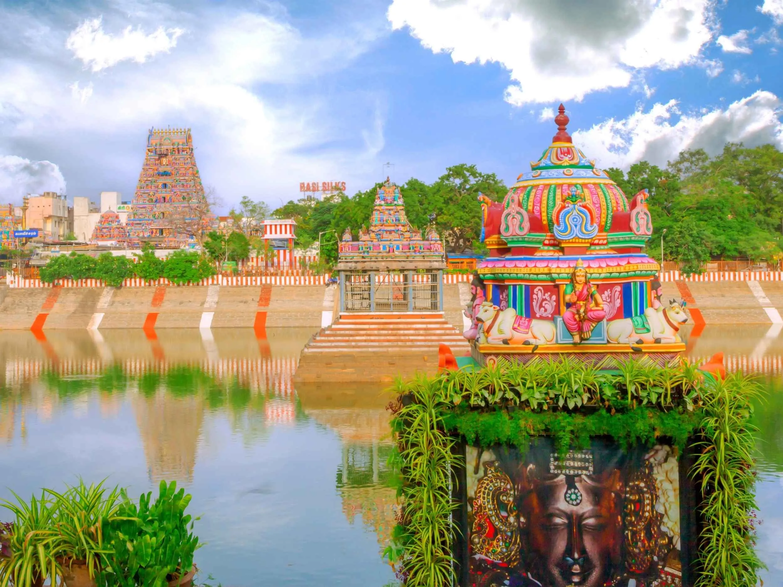 Intricately sculpted Dravidian Raja Gopuram of Kapaleeswarar Temple and sacred tank in Mylapore Chennai