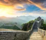 Great Wall of China winding over mountains at sunset