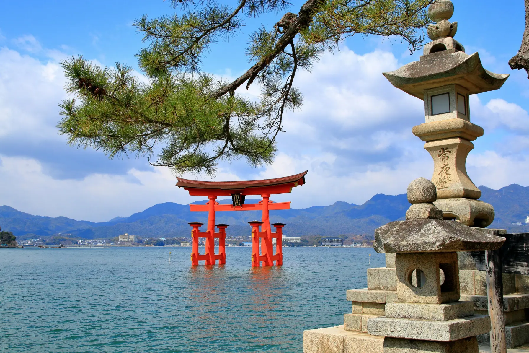 Great vermilion O-Torii gate of Itsukushima Shrine appearing to float on high tide at Miyajima Island near Hiroshima