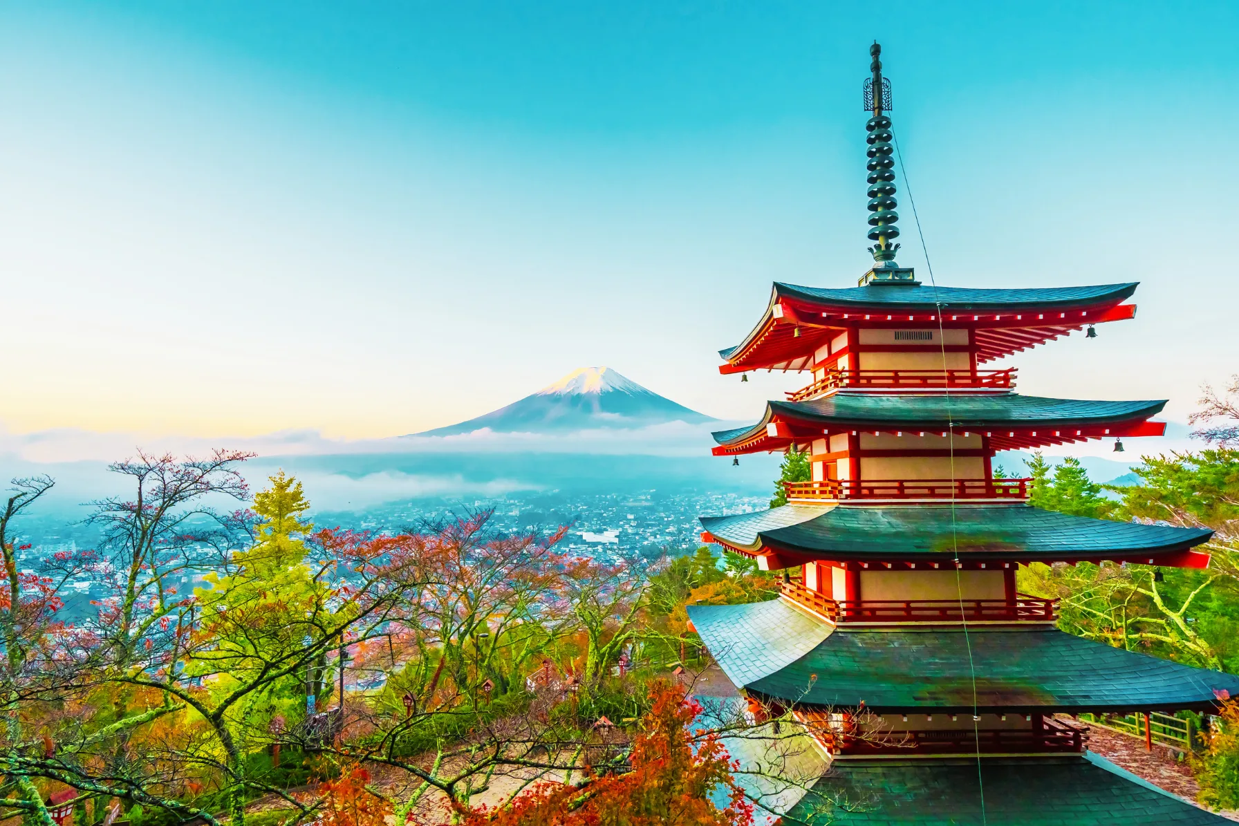 Japan travel guide hero panorama featuring Chureito Pagoda, Mount Fuji, cherry blossoms, and Kyoto heritage architecture