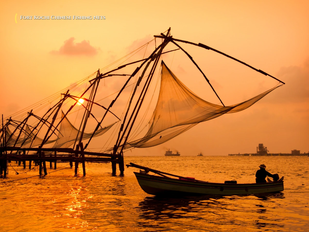 Iconic cantilevered Chinese fishing nets Cheena Vala at Fort Kochi harbor at sunset Kerala