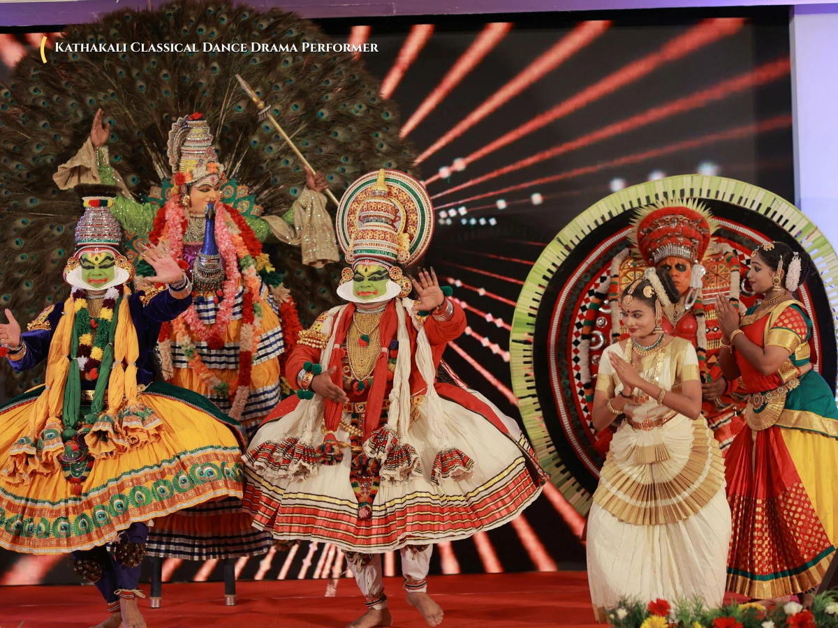 Traditional Kathakali performer in green Paccha face makeup and royal headdress during classical dance drama Kerala
